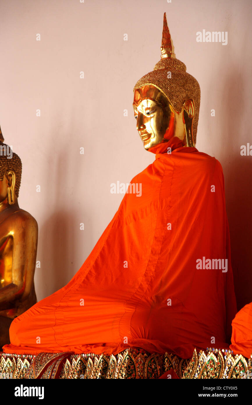 Golden Buddhist statue in Buddhist monk robe Stock Photo Alamy