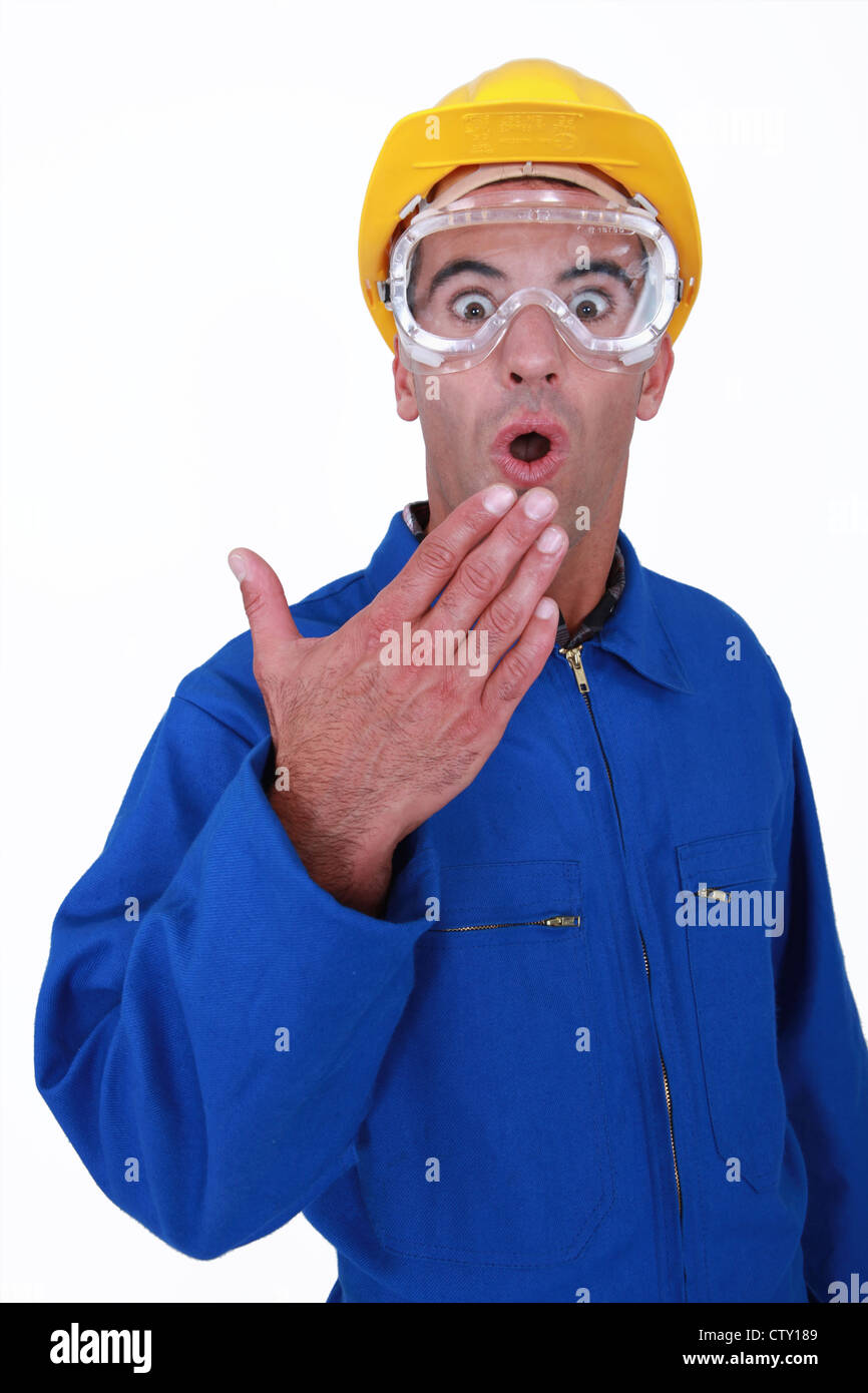 Shocked manual worker wearing safety glasses Stock Photo Alamy