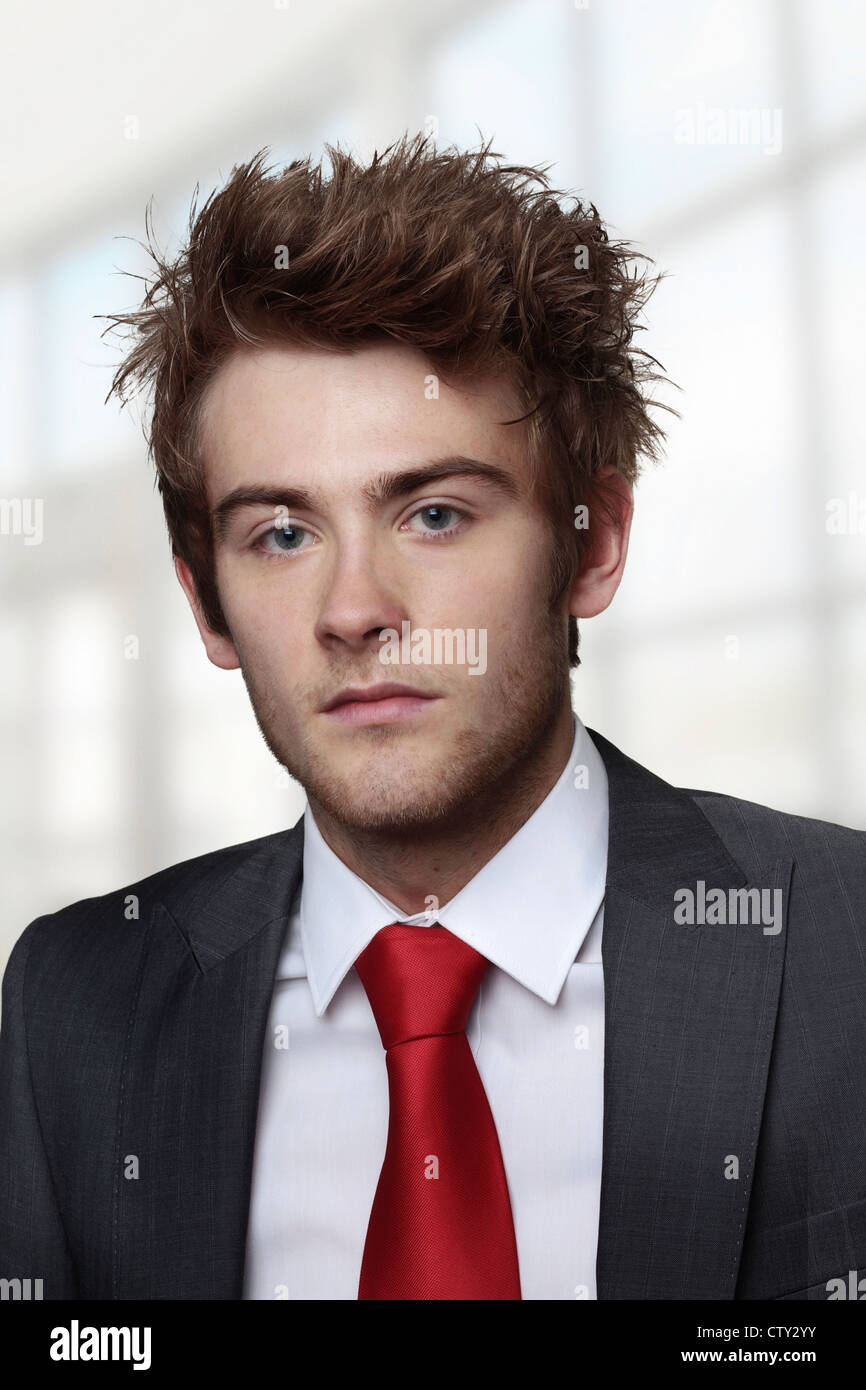 portrait of young businessman looking into camera Stock Photo - Alamy