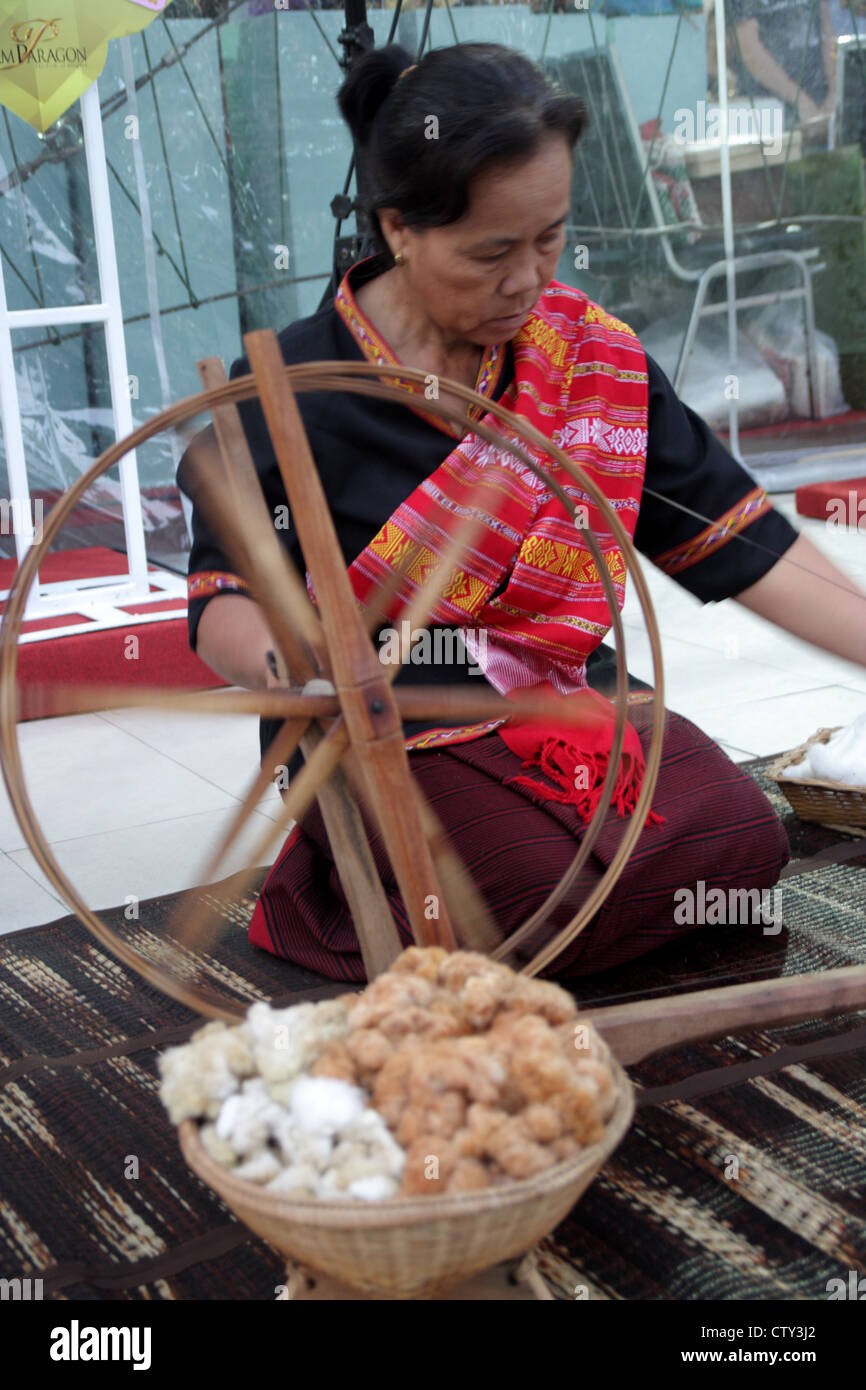 Thai woman making Thai traditional silk Stock Photo