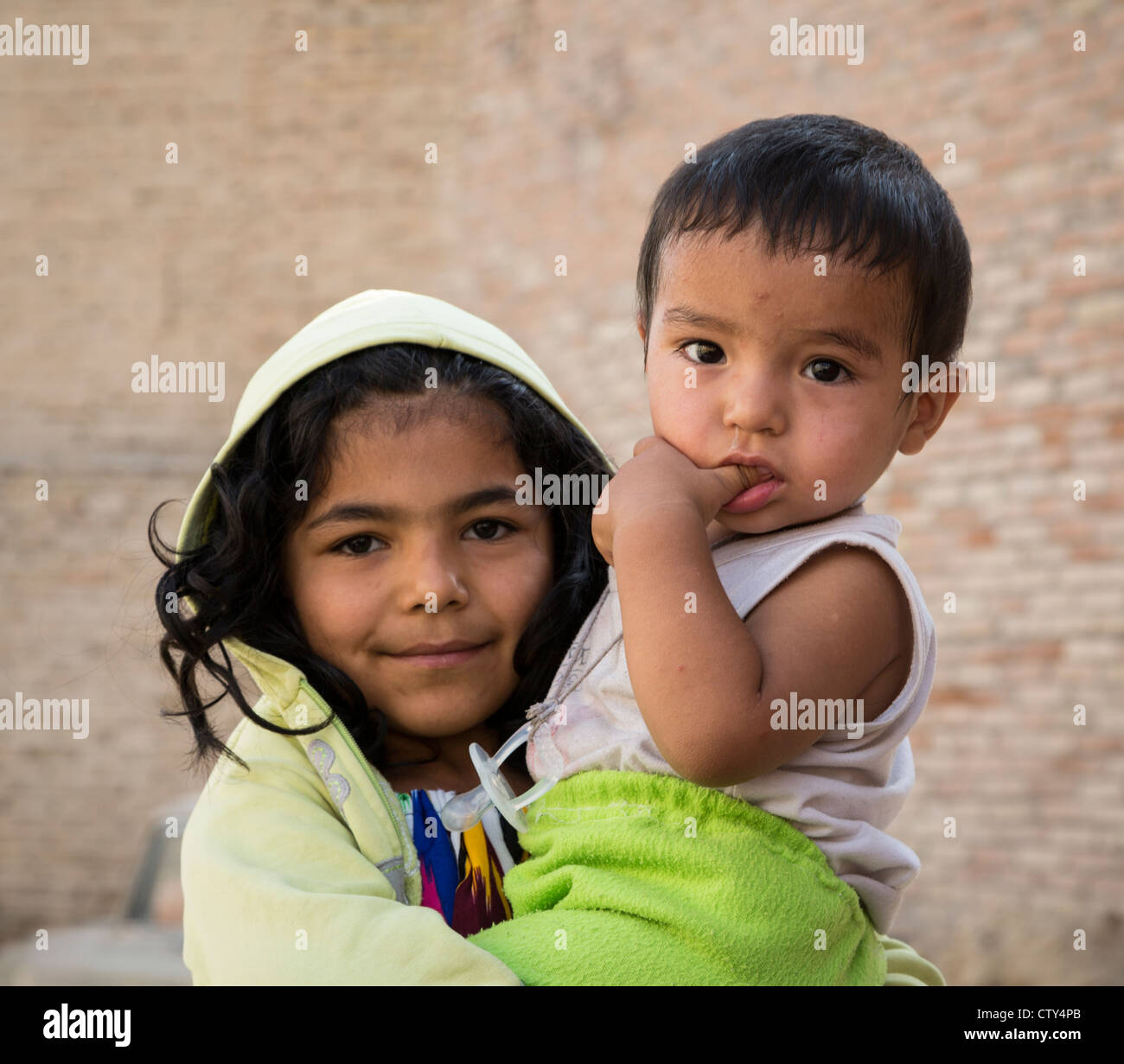 girl with toddler Istaravshan, Tajikistan Stock Photo