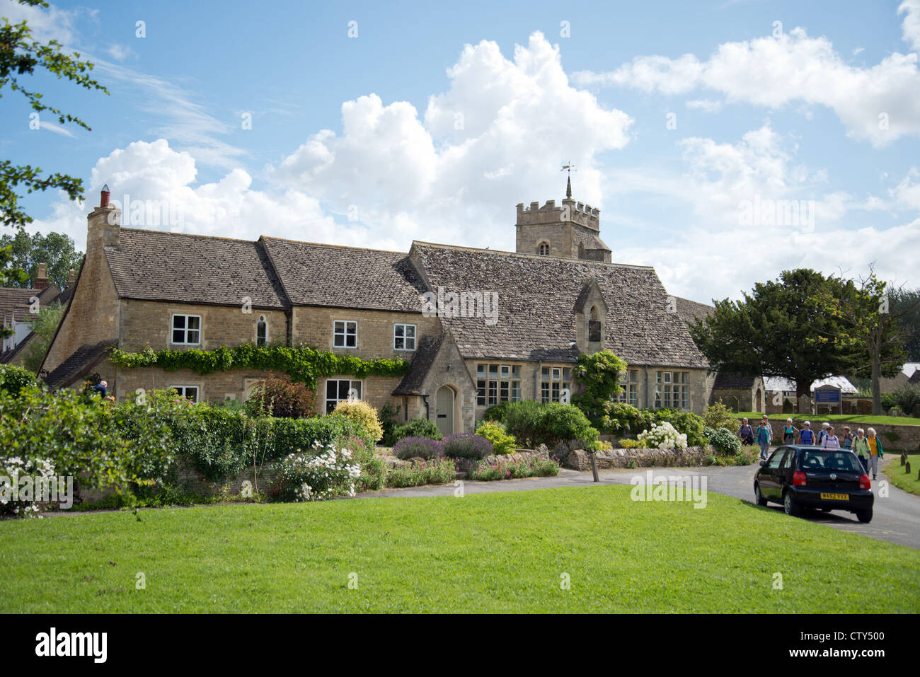 Cottages on village green, Ducklington, Oxfordshire, England, United Kingdom Stock Photo