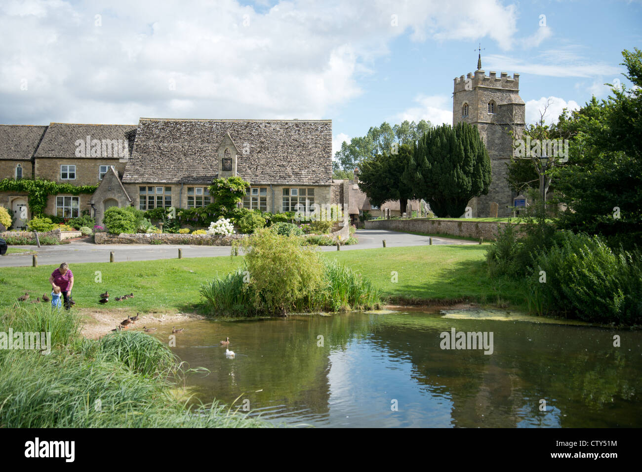 Village green and pond, Ducklington, Oxfordshire, England, United Kingdom Stock Photo