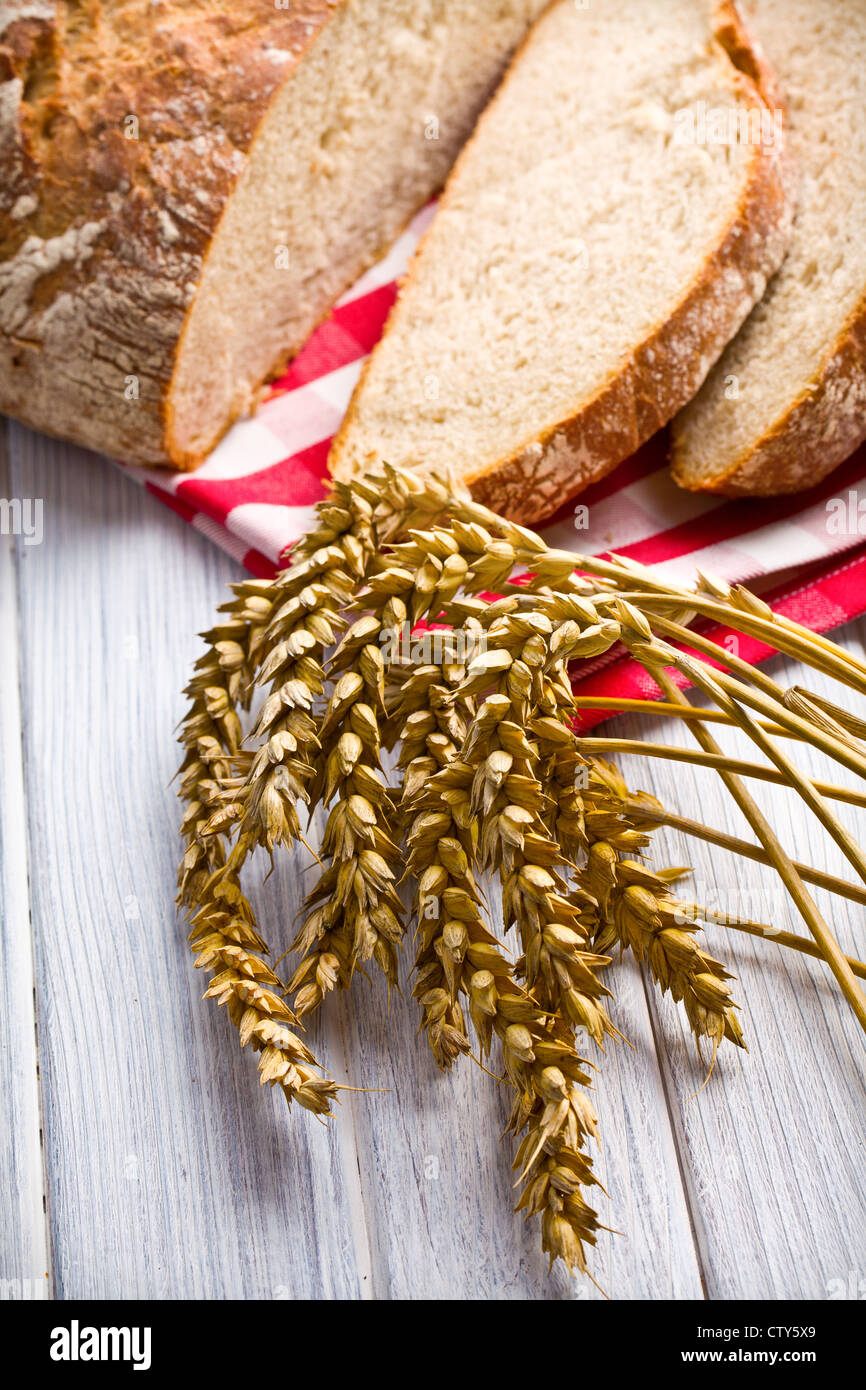 wheat and bread on kitchen table Stock Photo - Alamy