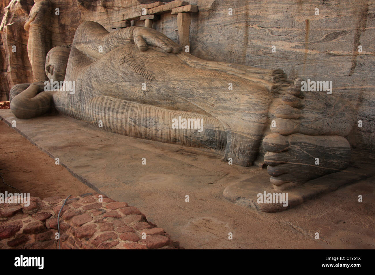 Reclining Buddha carved from rock, Polonnaruwa, Sri Lanka Stock Photo