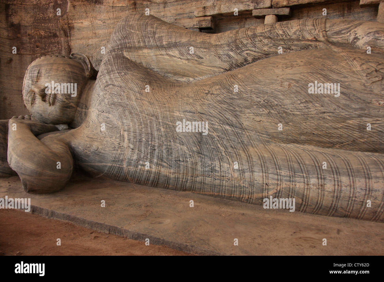 Reclining Buddha carved from rock, Polonnaruwa, Sri Lanka Stock Photo