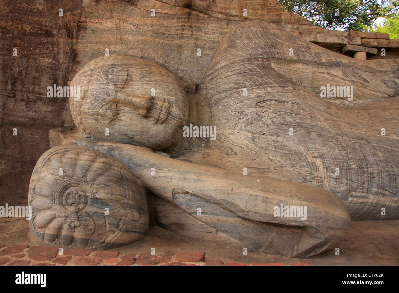 Portrait of reclining Buddha carved from rock, Polonnaruwa, Sri Lanka Stock Photo