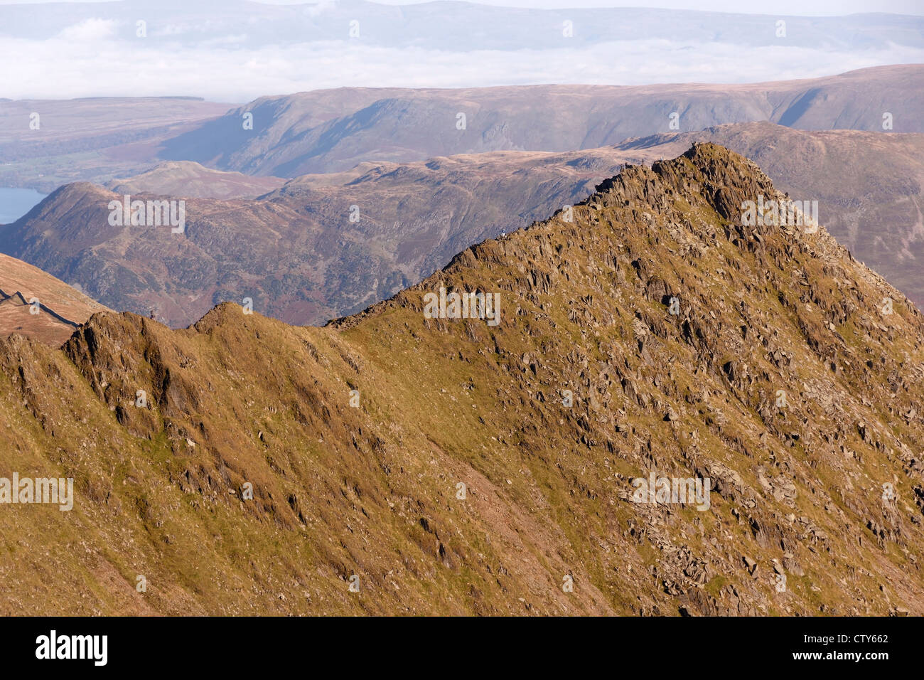 Hill walkers on Striding Edge, Helvellyn, Lake District, Cumbria, England, UK Stock Photo
