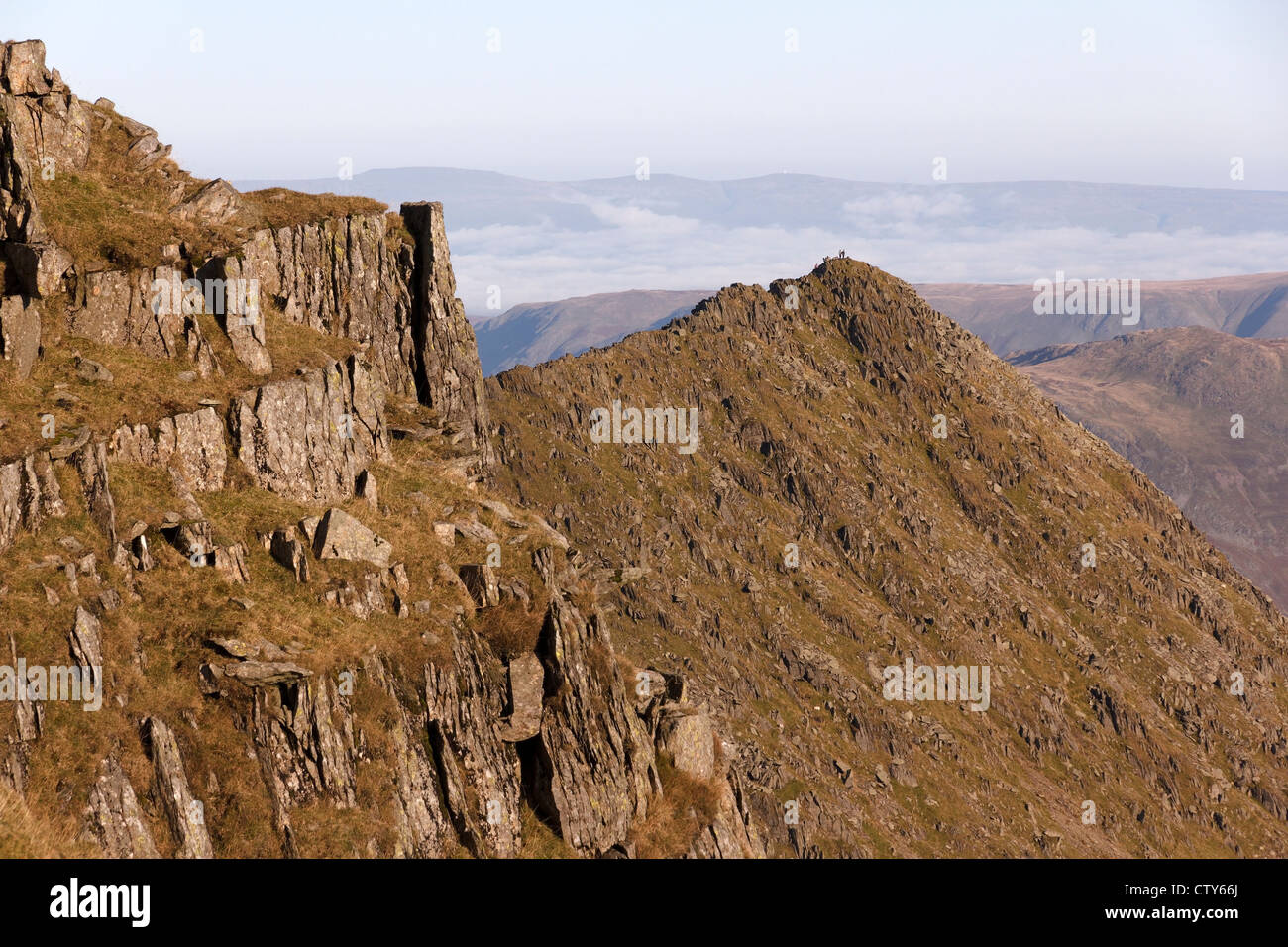 Hill walkers on Striding Edge, Helvellyn, Lake District, Cumbria, England, UK Stock Photo