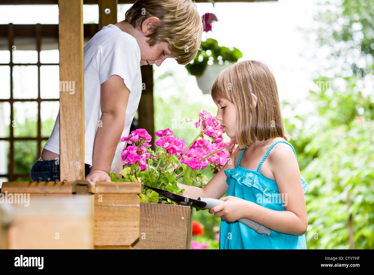 Children Working In The Garden Stock Photo Alamy Children Working In The Garden Stock Photo Alamy