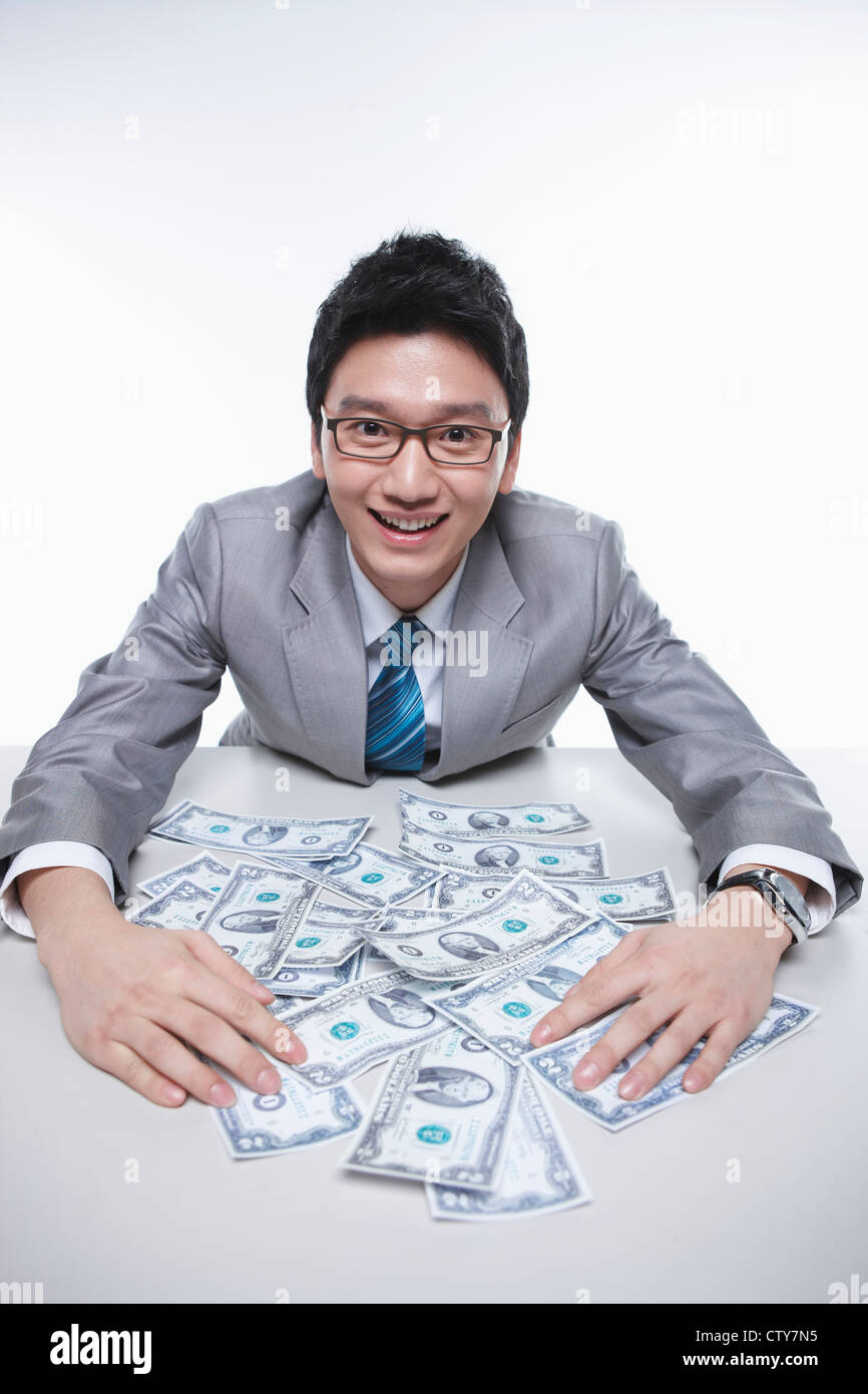 A happy businessman earning the big money Stock Photo