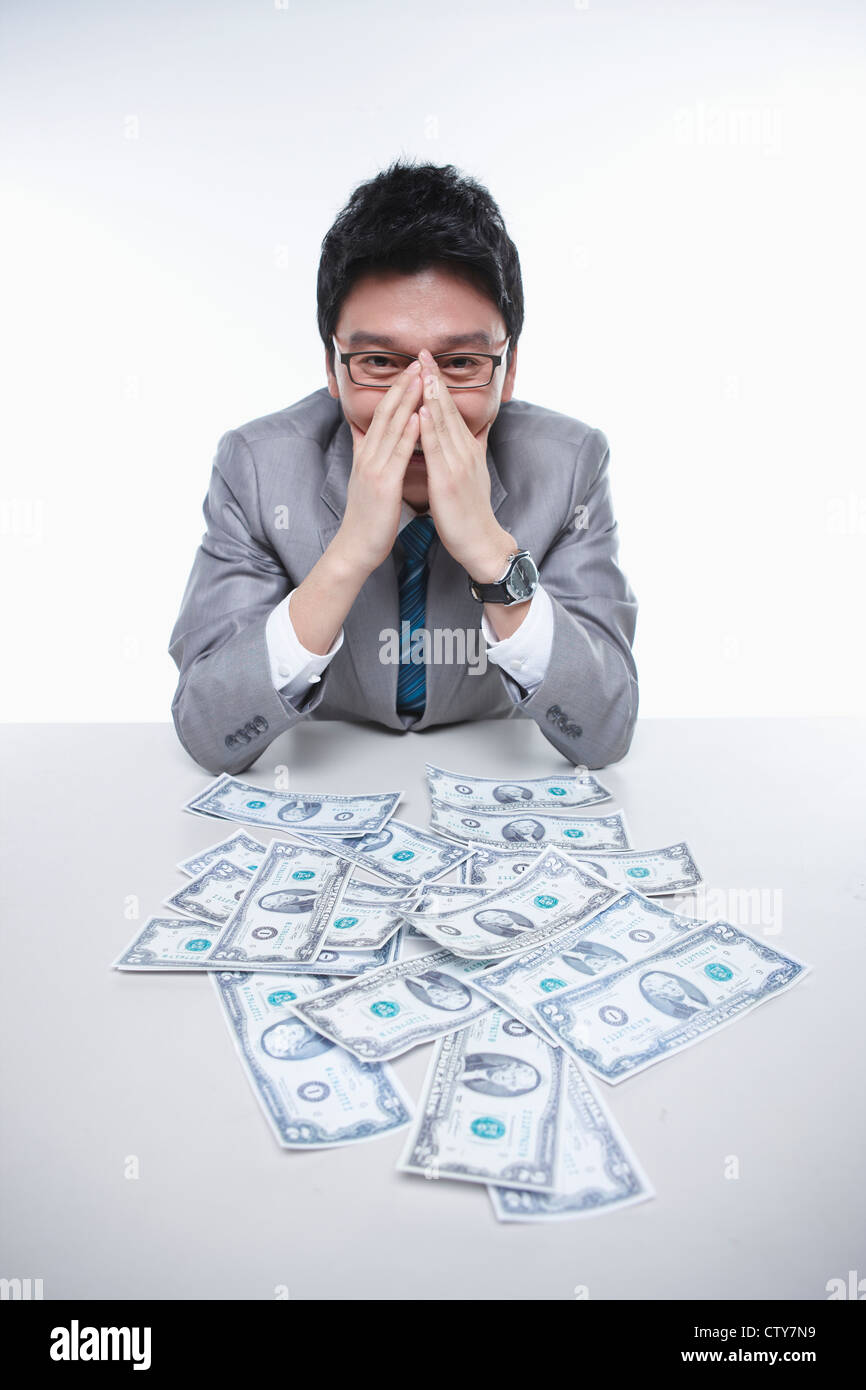 A happy businessman earning the big money Stock Photo