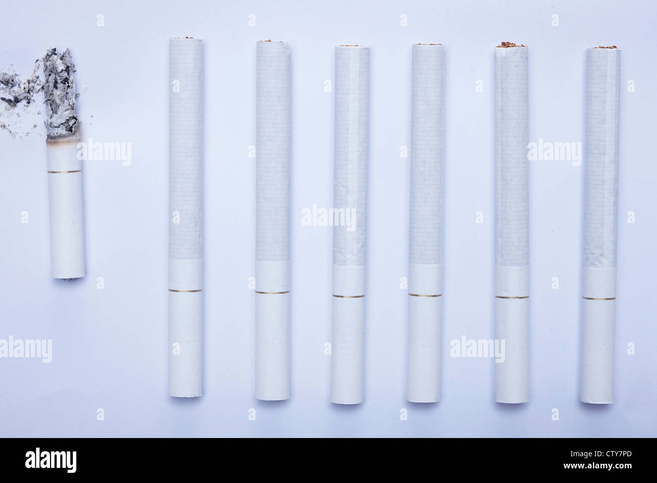 Long cigarettes and a short cigarette Stock Photo Alamy