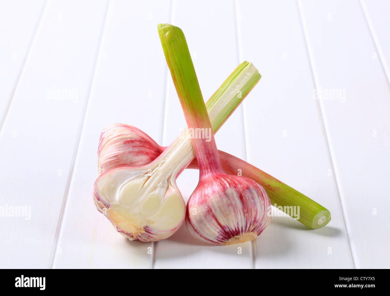 Three fresh garlic bulbs studio shot Stock Photo Alamy