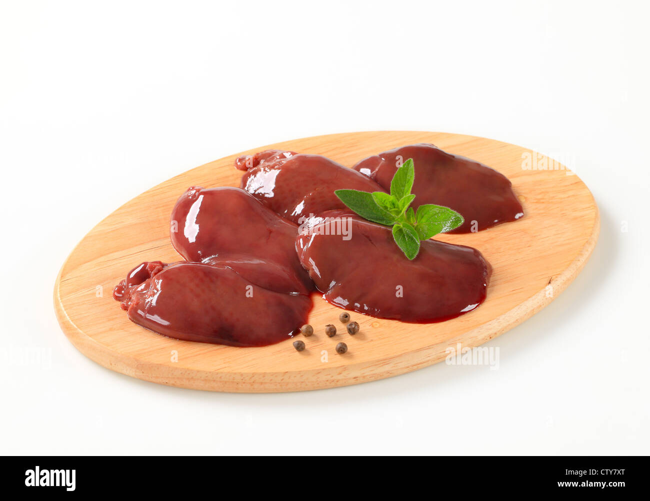 Raw chicken liver on cutting board Stock Photo