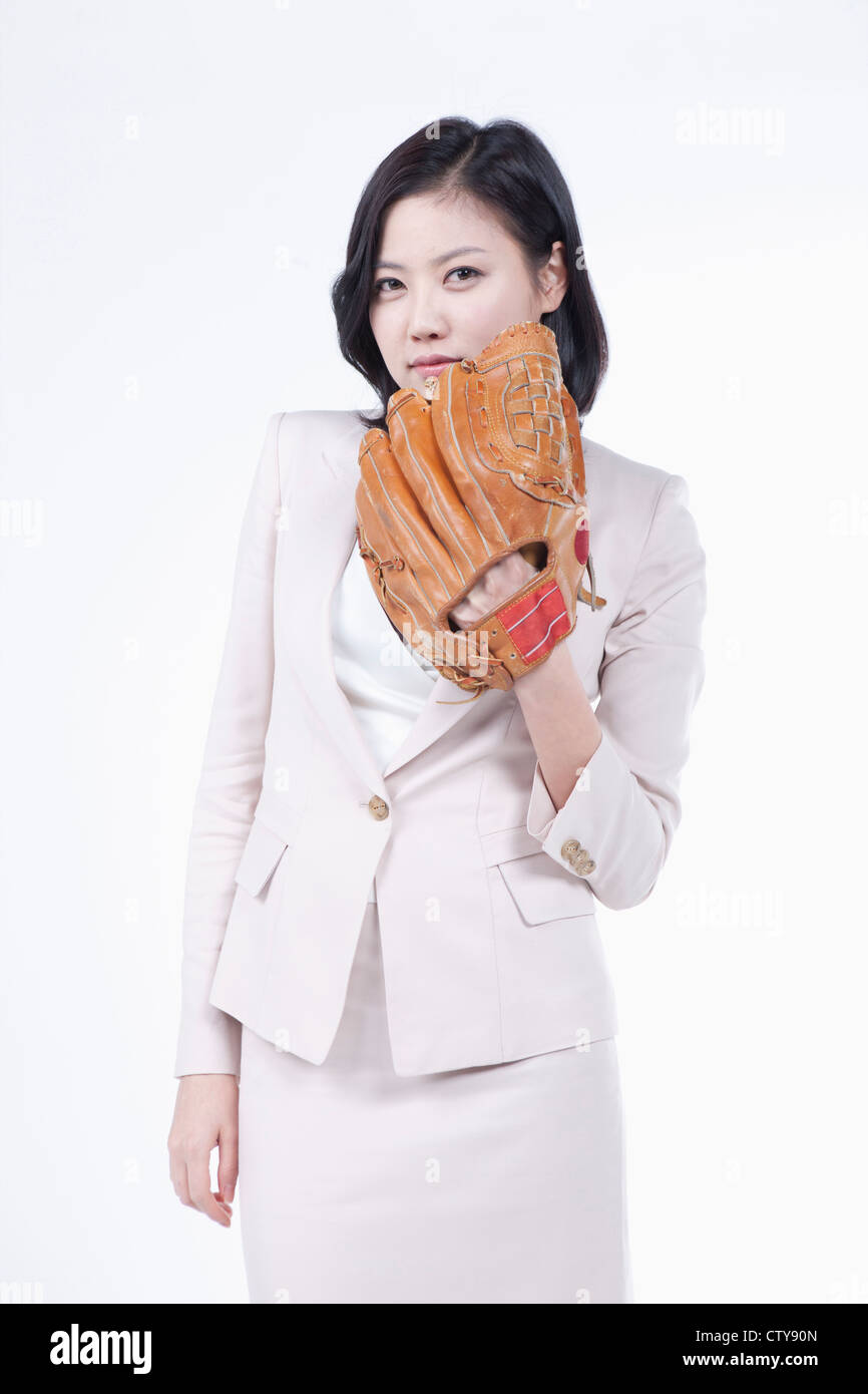 A woman wearing a baseball glove Stock Photo Alamy