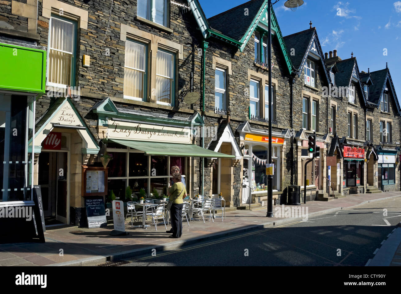 Shop shop store stores in the town centre in summer Windermere Cumbria England UK United Kingdom GB Great Britain Stock Photo