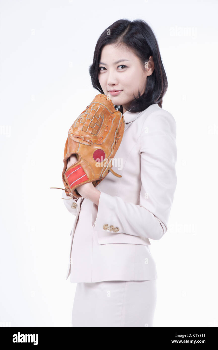 A woman wearing a baseball glove Stock Photo Alamy