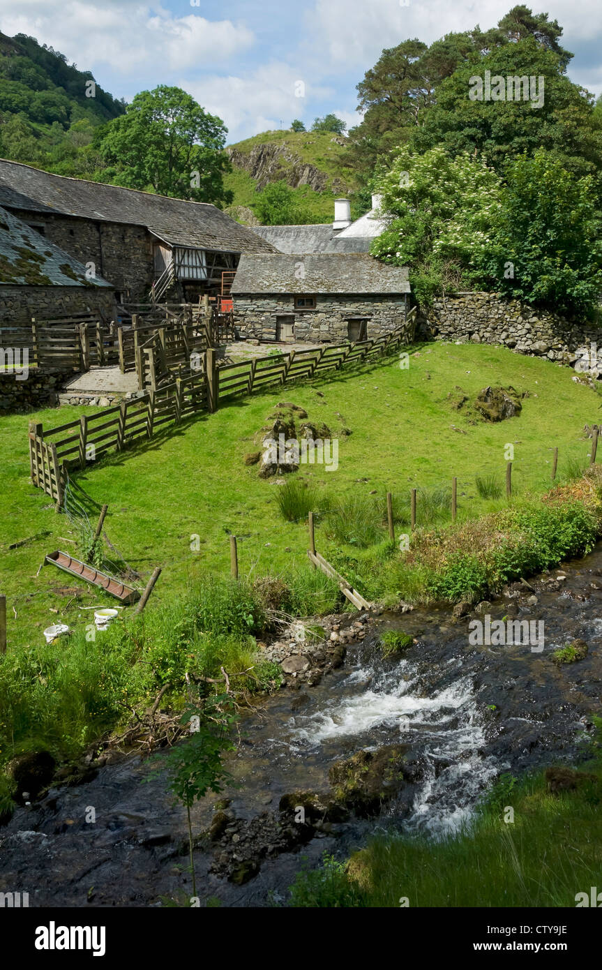 Yew Tree Farm Cottage and farm buildings (once owned by Beatrix Potter) in summer near Coniston Cumbria England UK United Kingdom GB Great Britain Stock Photo