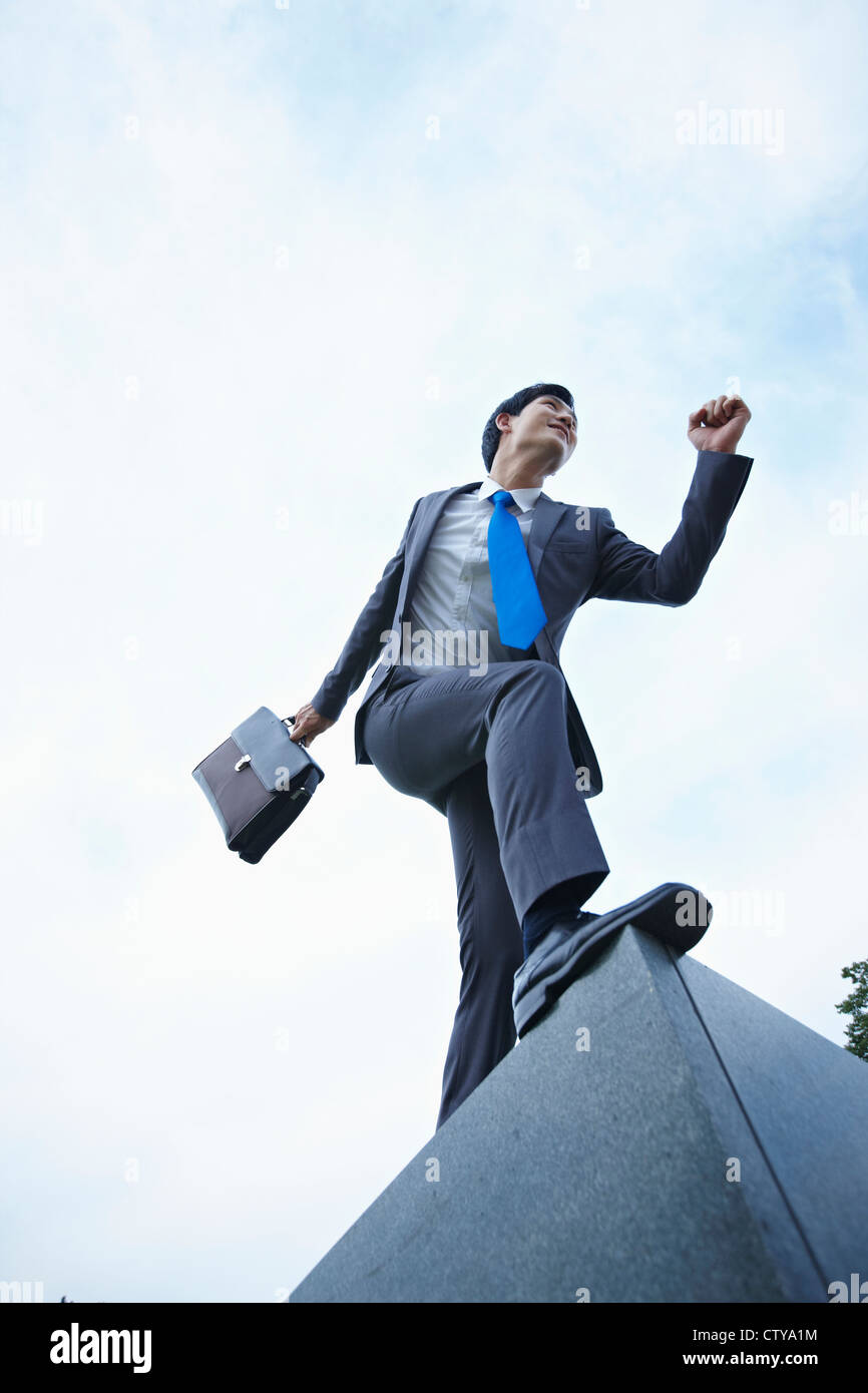 A businessman running with the briefcase Stock Photo - Alamy