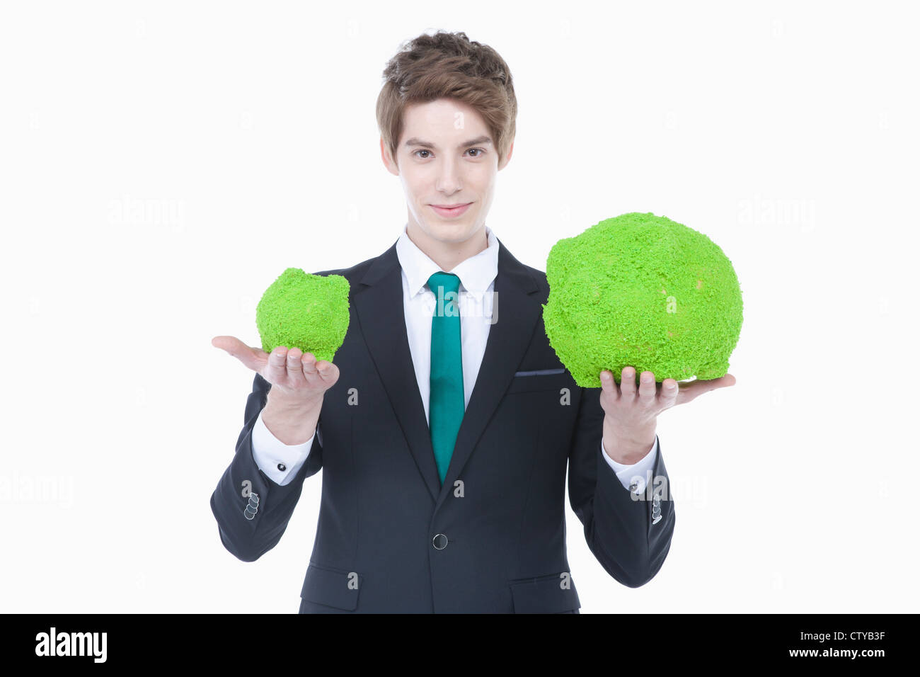 A man with green piggy banks Stock Photo - Alamy