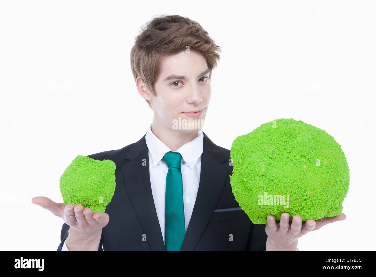 A man with green piggy banks Stock Photo - Alamy