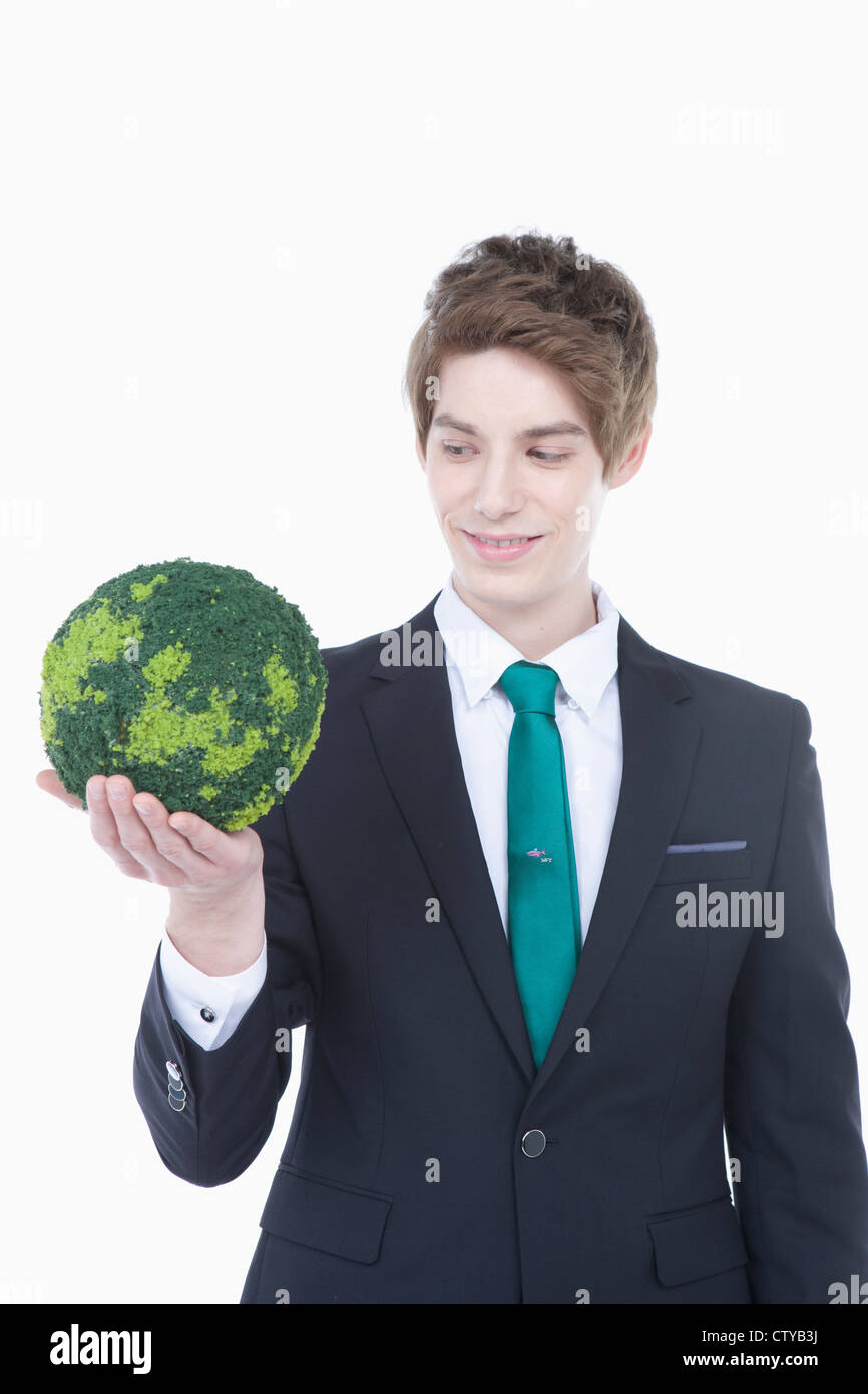 A man with a green globe Stock Photo Alamy
