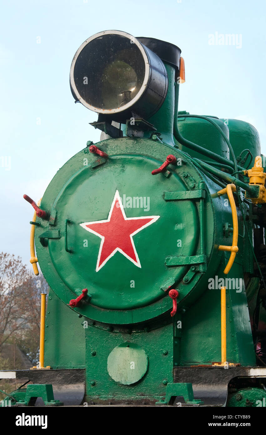 Part of old locomotive with Soviet red star Stock Photo