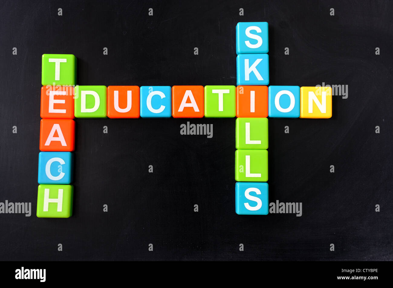 Education related crosswords on the blackboard Stock Photo