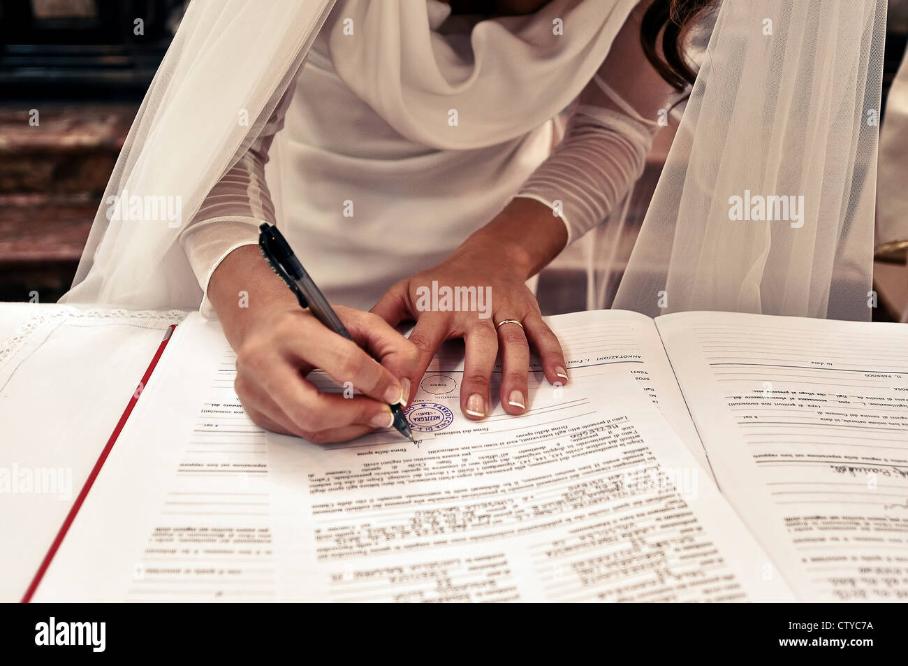 Bride signing wedding papers at an Italian wedding Stock Photo Alamy