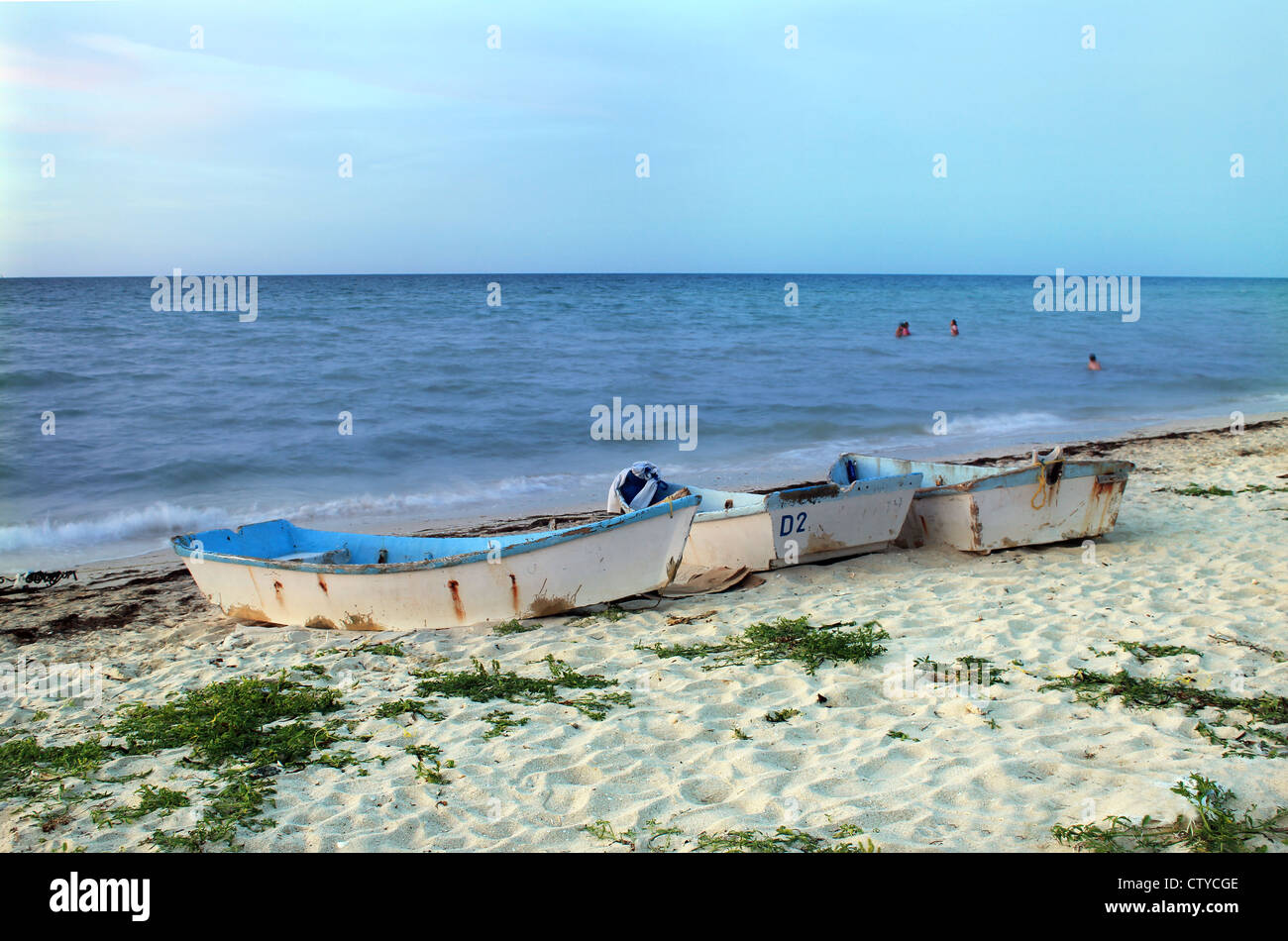 Empty rowboats with resting on sandy beach in Progreso, Yucatan, Mexico Stock Photo