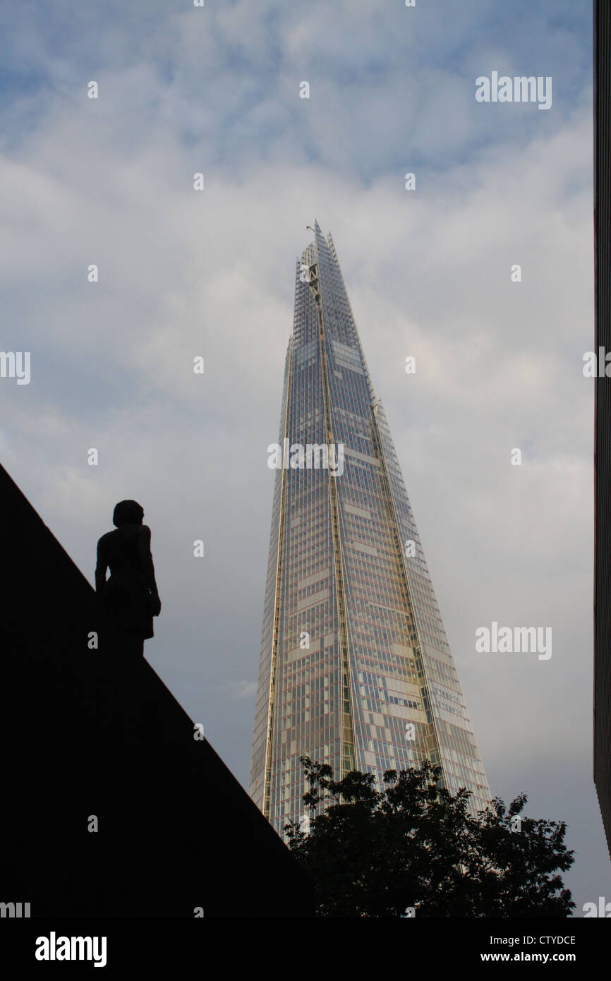 Shard contrasted against female statue Stock Photo