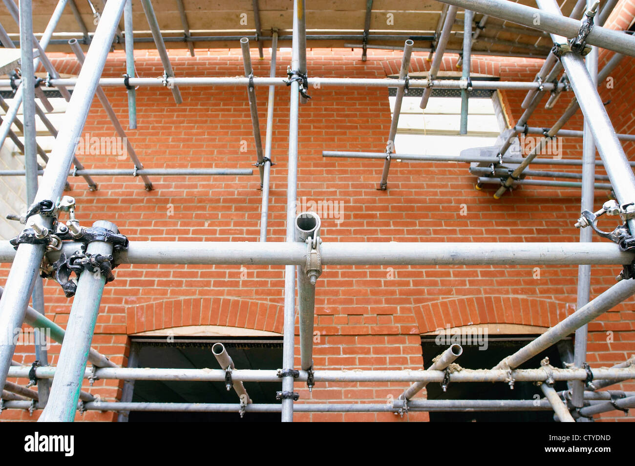 Scaffolding on brick wall Stock Photo - Alamy