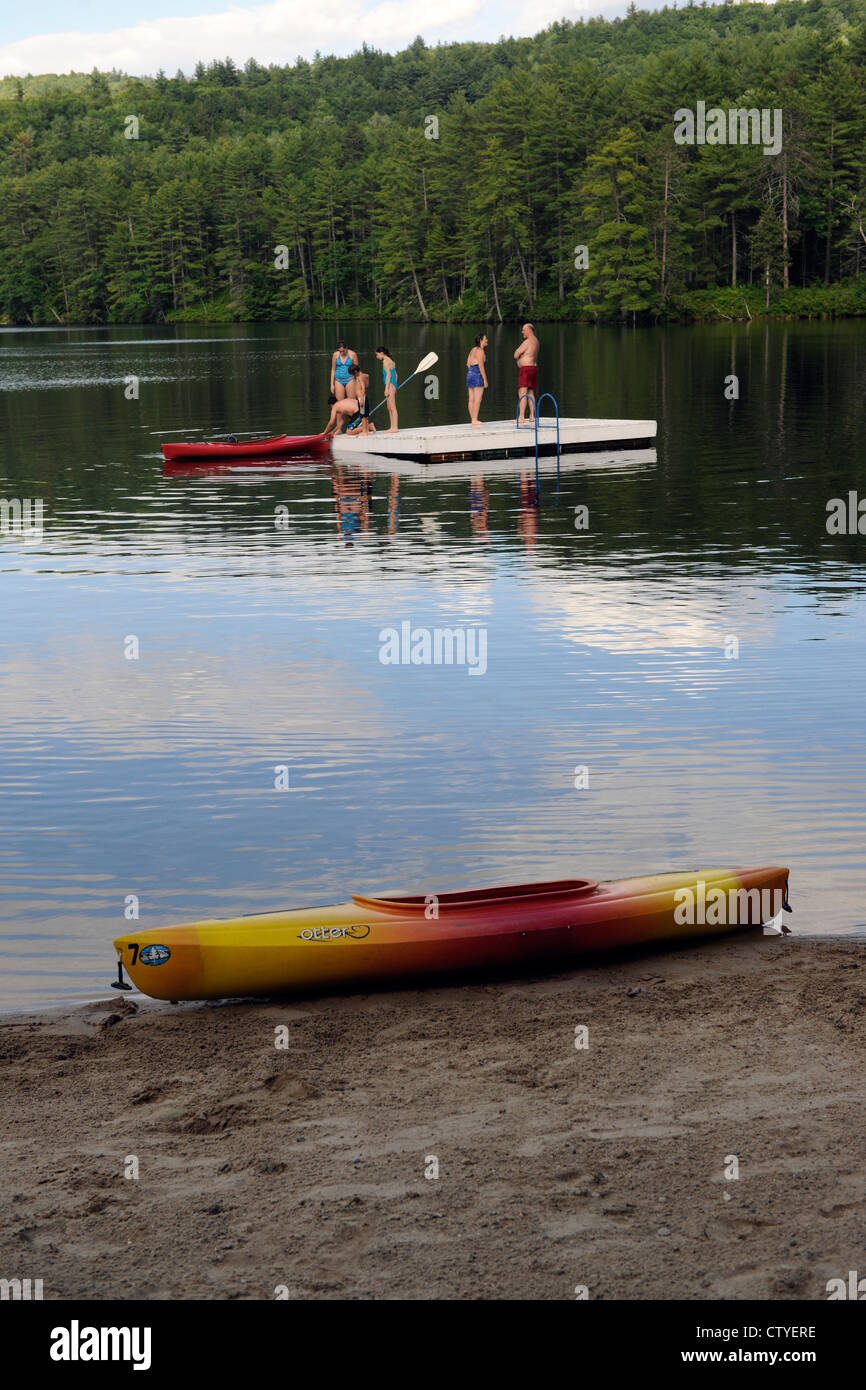 Vacationers at family reunion swim in Purity Lake at Purity Spring Resort in East Madison, New Hampshire. Stock Photo