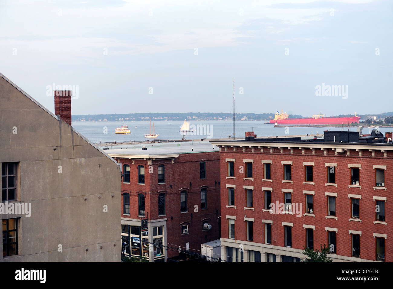 Portland, Maine. View of harbor with building at 100 Commercial Street in foreground. Stock Photo