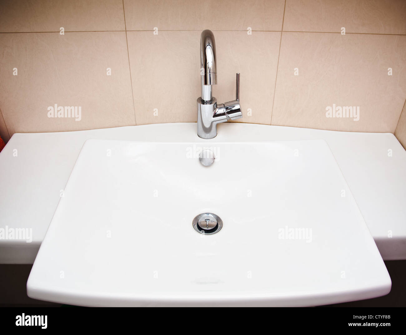 Modern bathroom sink in white ceramic Stock Photo