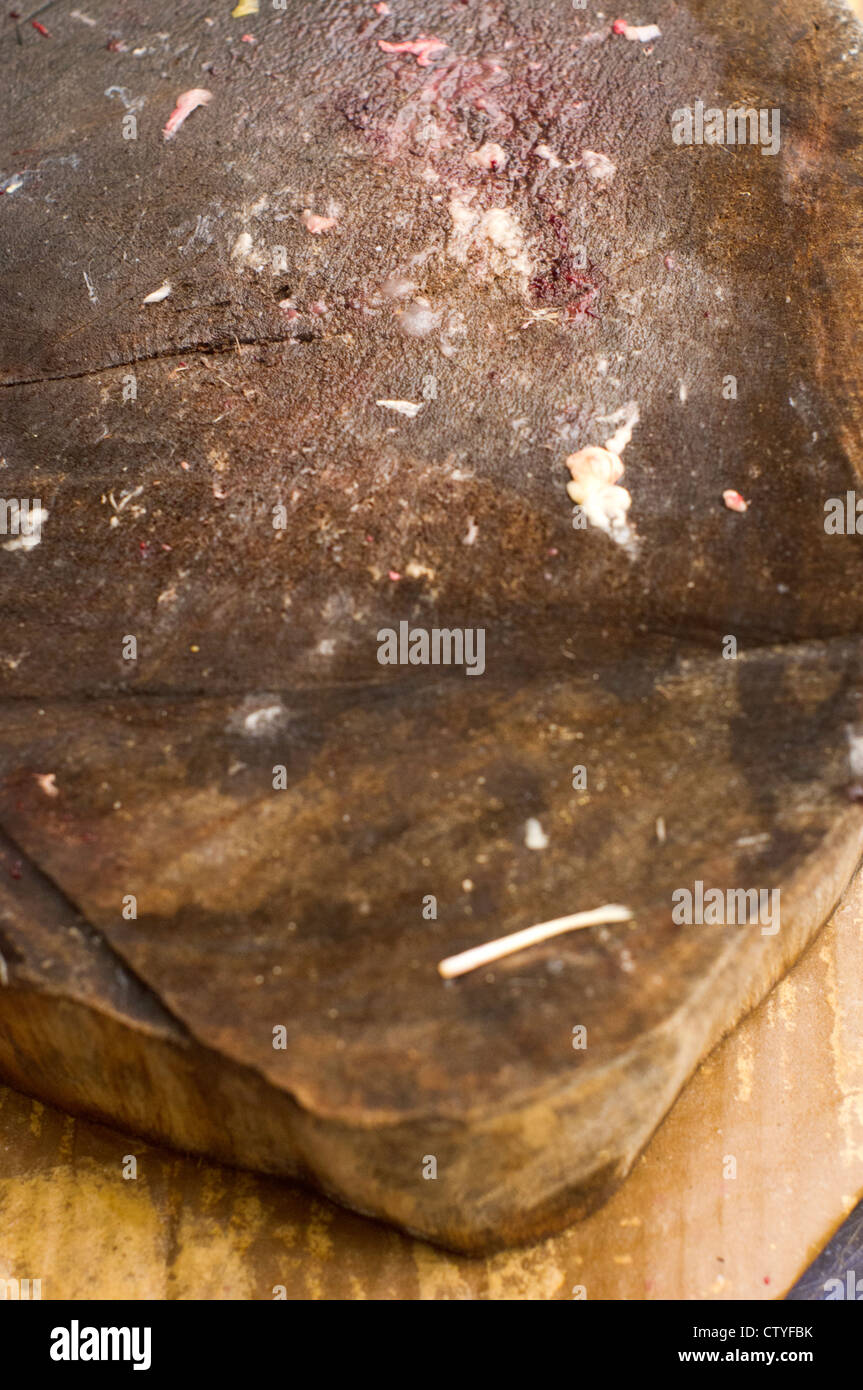 a close up shot of chopping block with blood remaining, for cruelty concept. Stock Photo