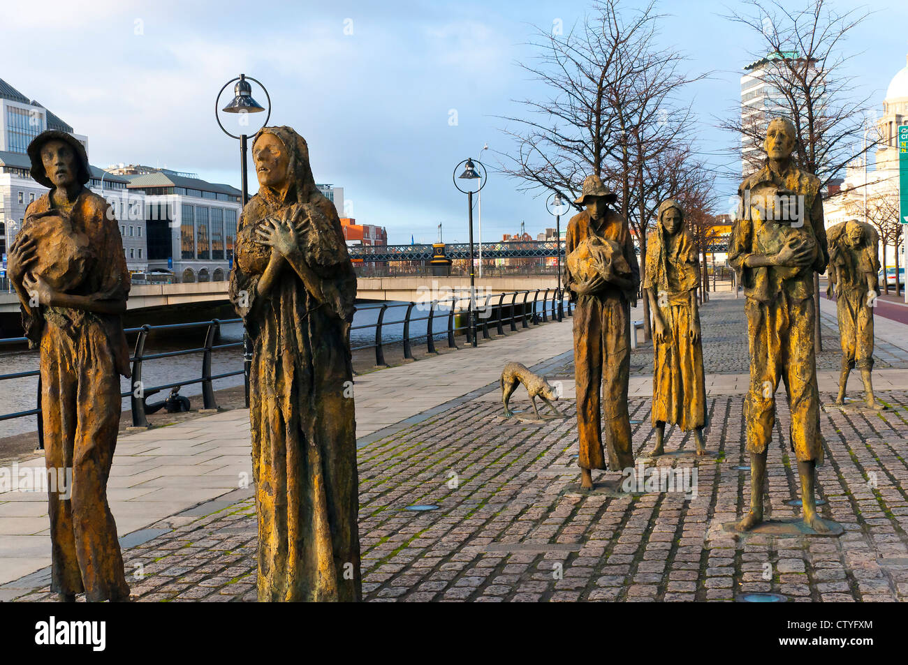 Monument to the Potato Famine Victims on the quayside of the River