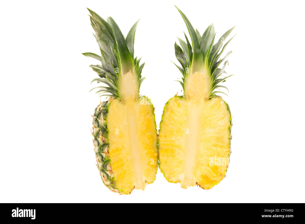 Fresh pineapple cut in half studio shot with a white background Stock