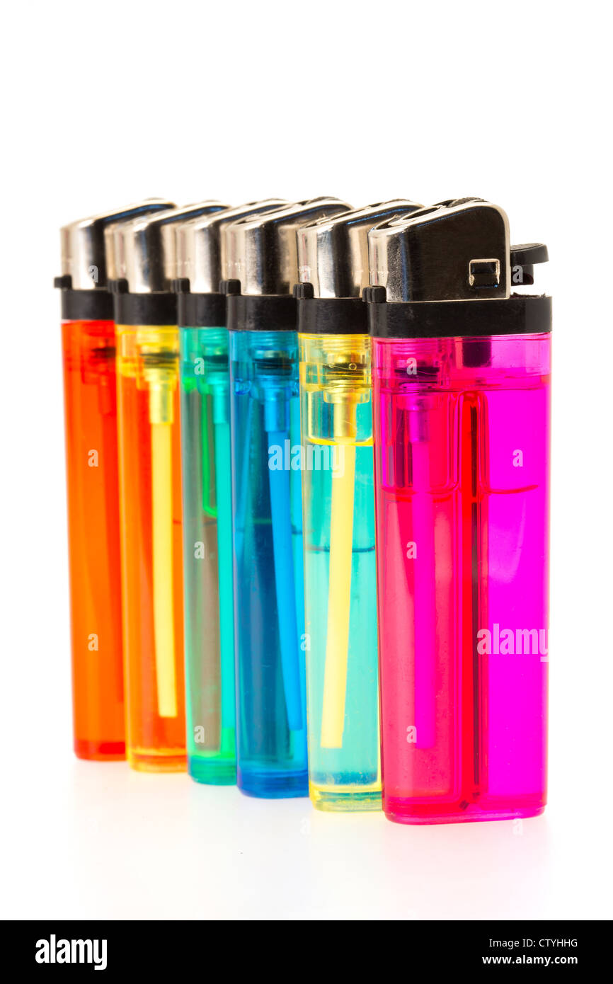 Multi-coloured gas cigarette lighters in a row - studio shot with a white background Stock Photo