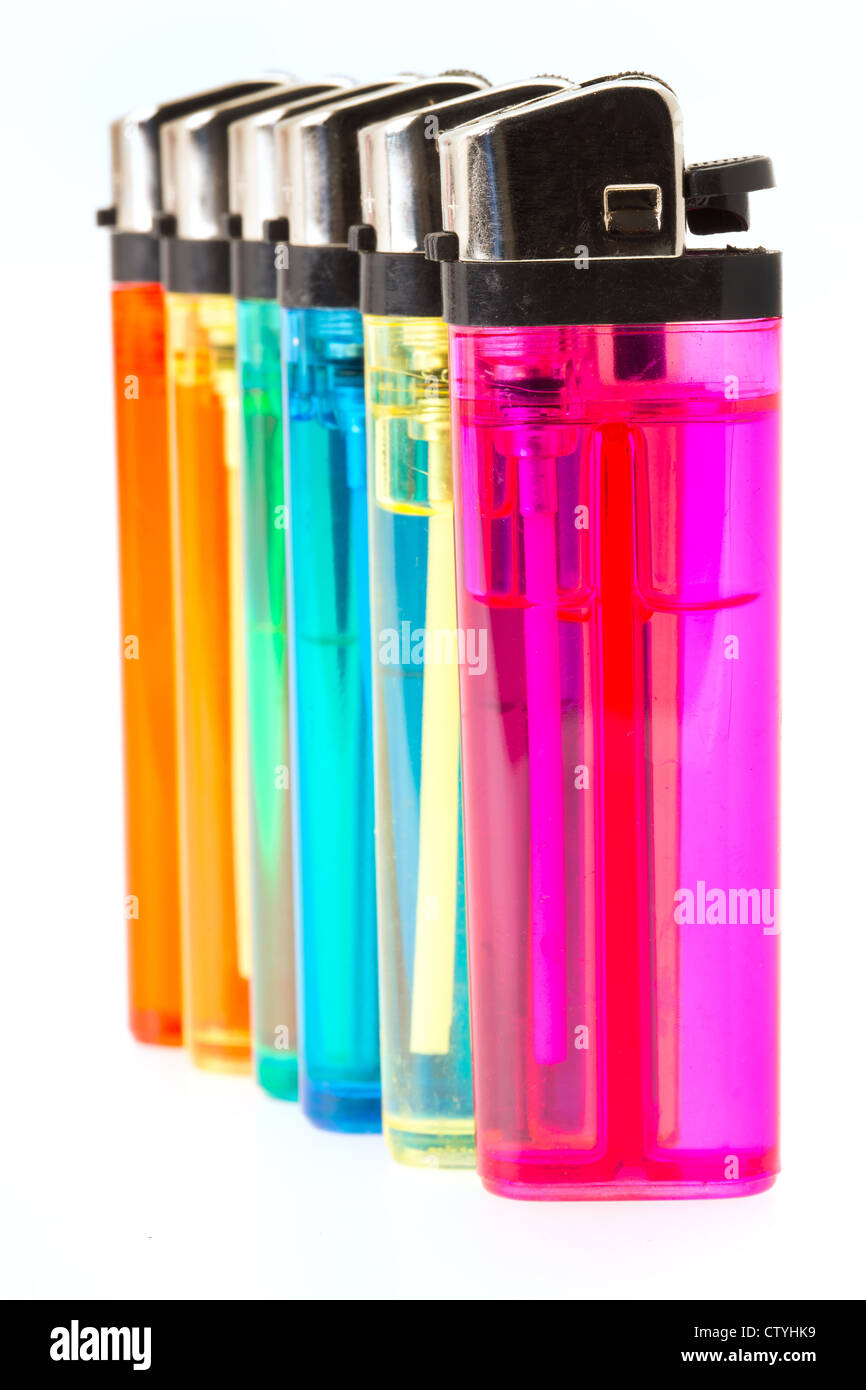 Multi-coloured gas cigarette lighters in a row - studio shot with a white background Stock Photo