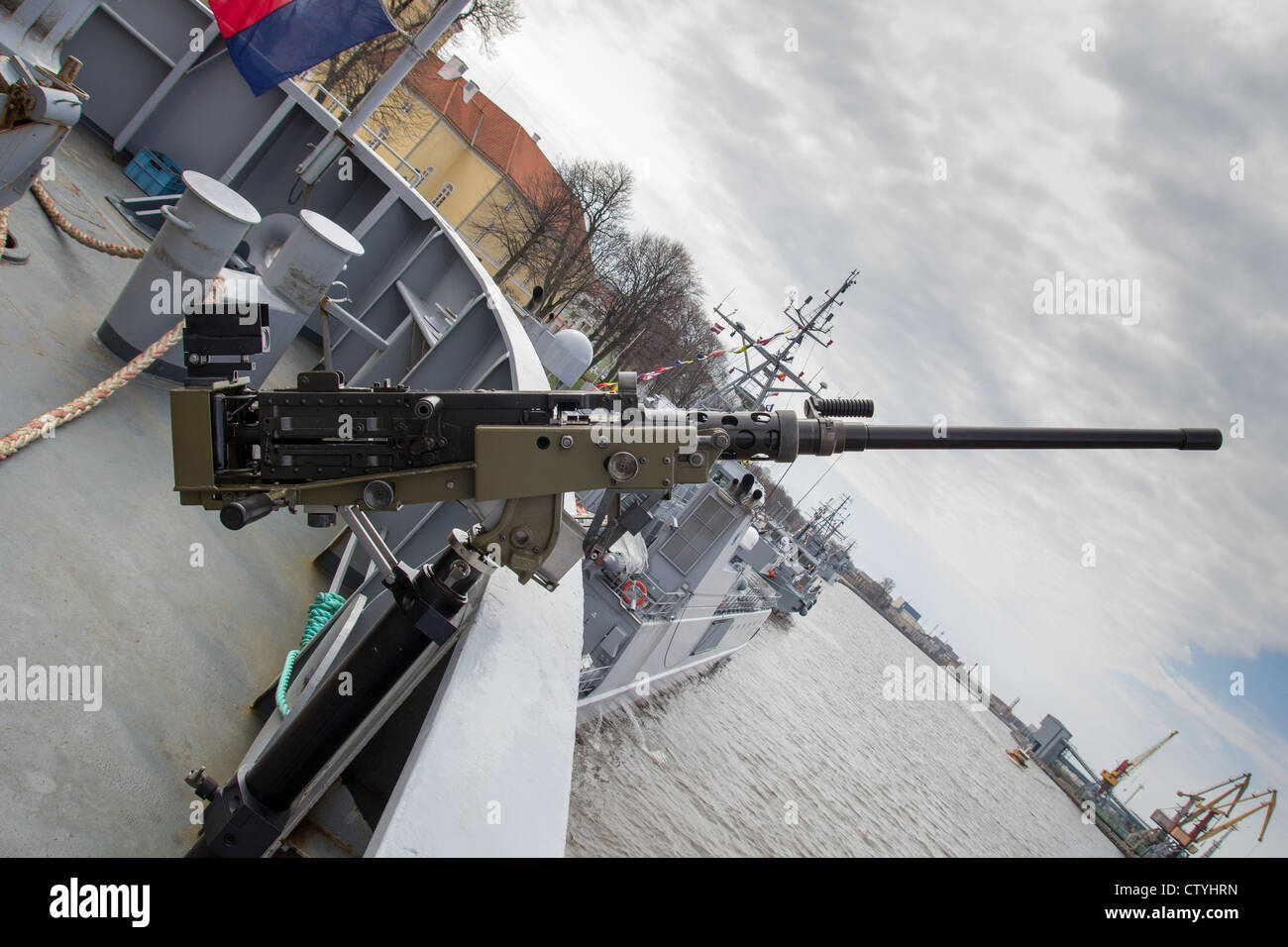 machine gun on warship against dark sky Stock Photo