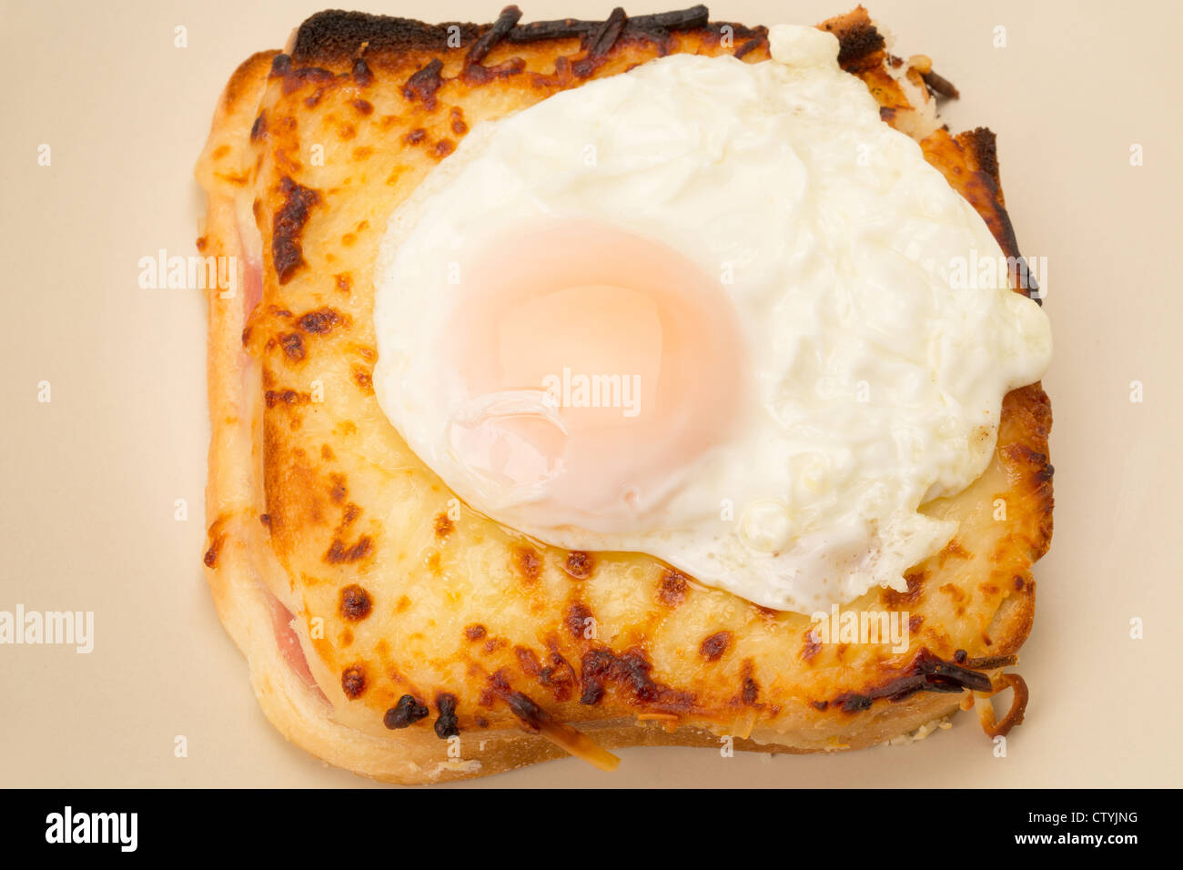 Classic French toasted sandwich or Croque Madame with a fried egg on