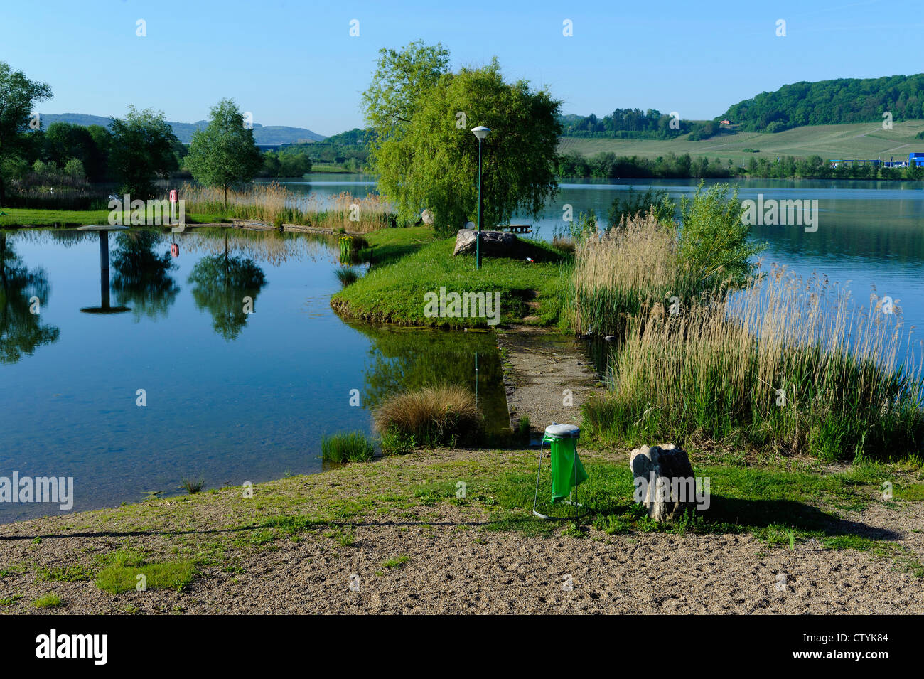 flooded gravel pit and nature sanctuary Reimecher Haff near Remerschen ...