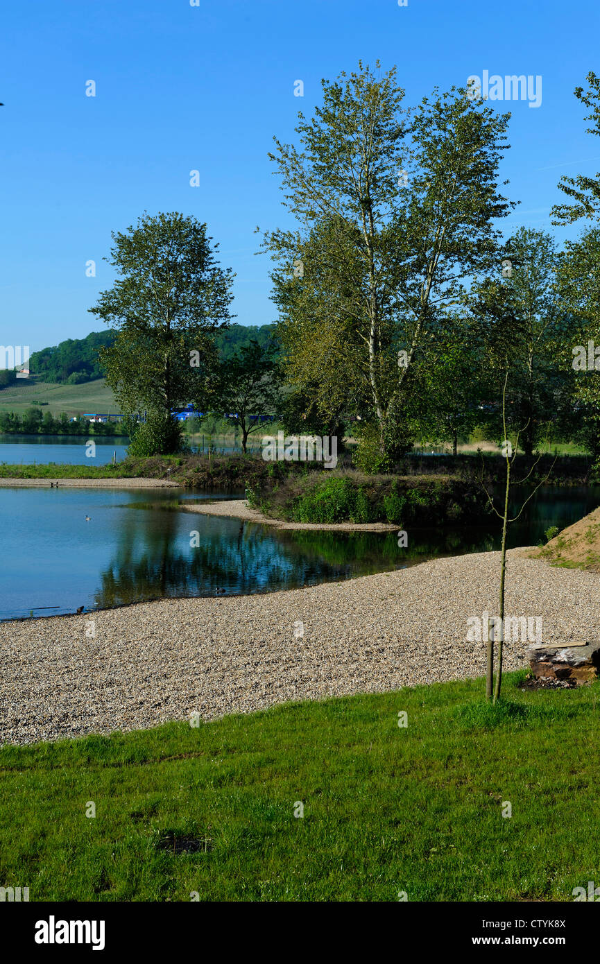 flooded gravel pit and nature sanctuary Reimecher Haff near Remerschen ...