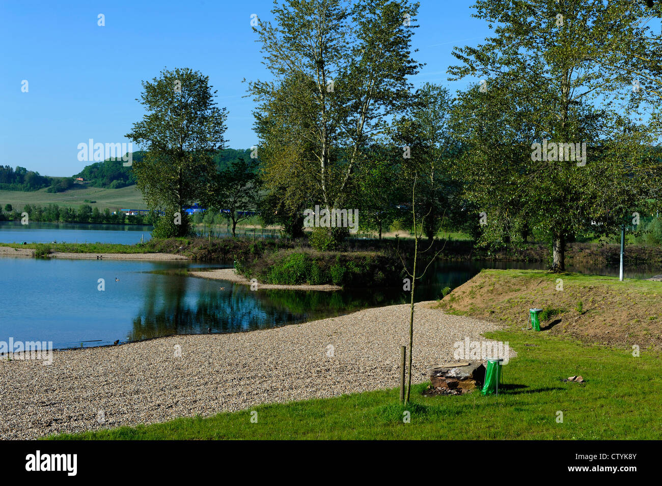 flooded gravel pit and nature sanctuary Reimecher Haff near Remerschen ...
