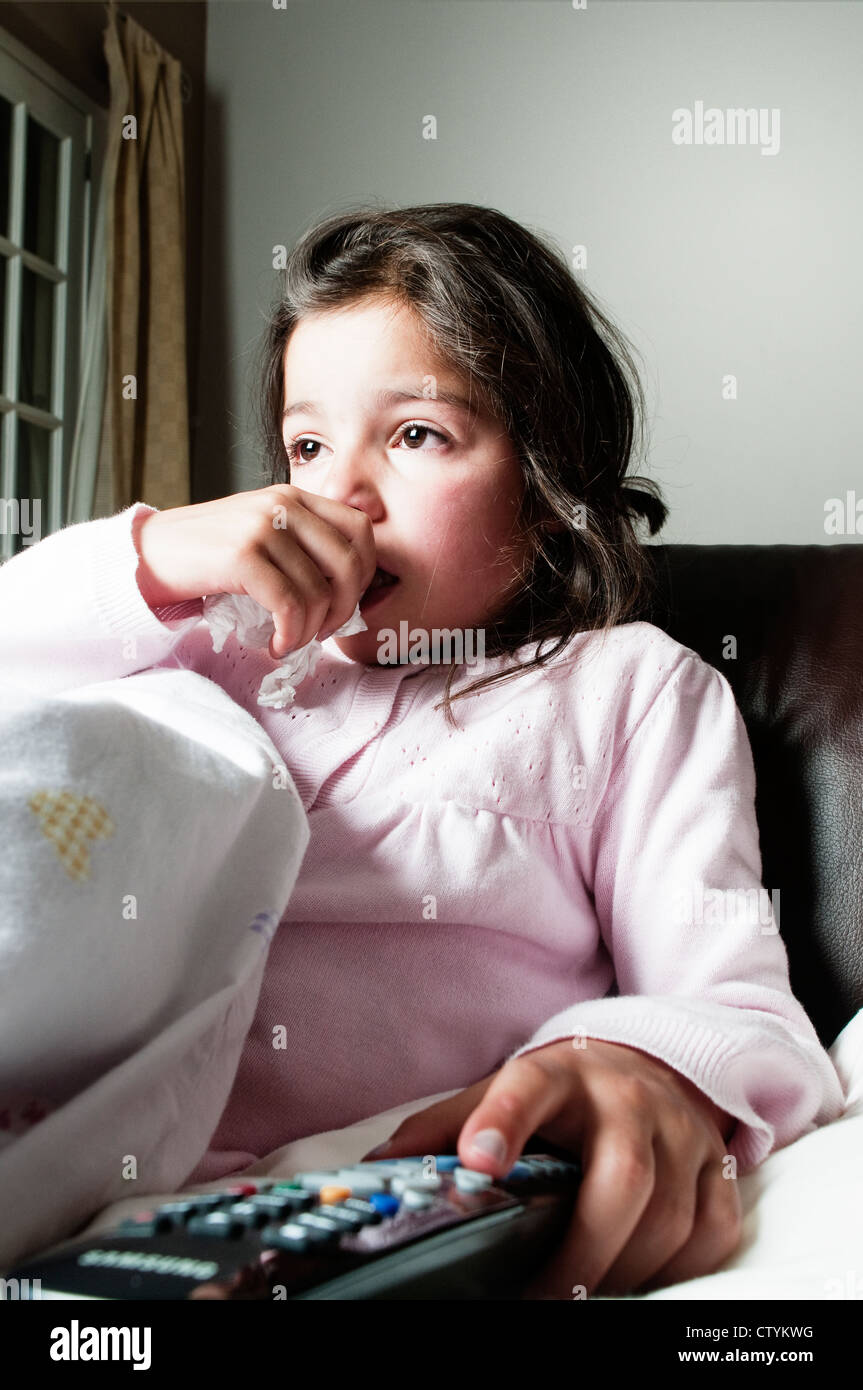 Child with a flu like symptoms at home Stock Photo