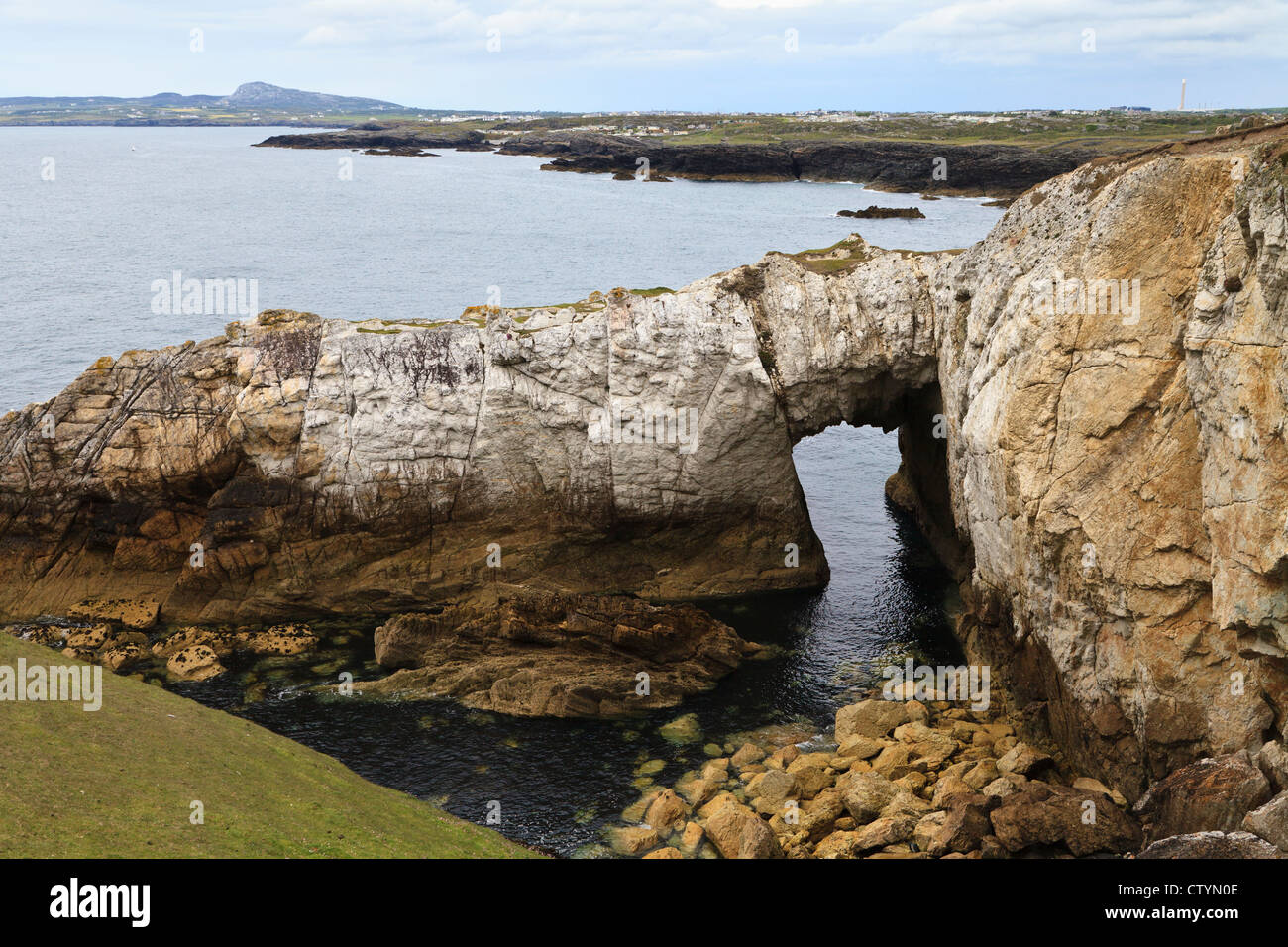 Bwa Du natural arch, near Rhoscolyn, Anglesey, Wales Stock Photo