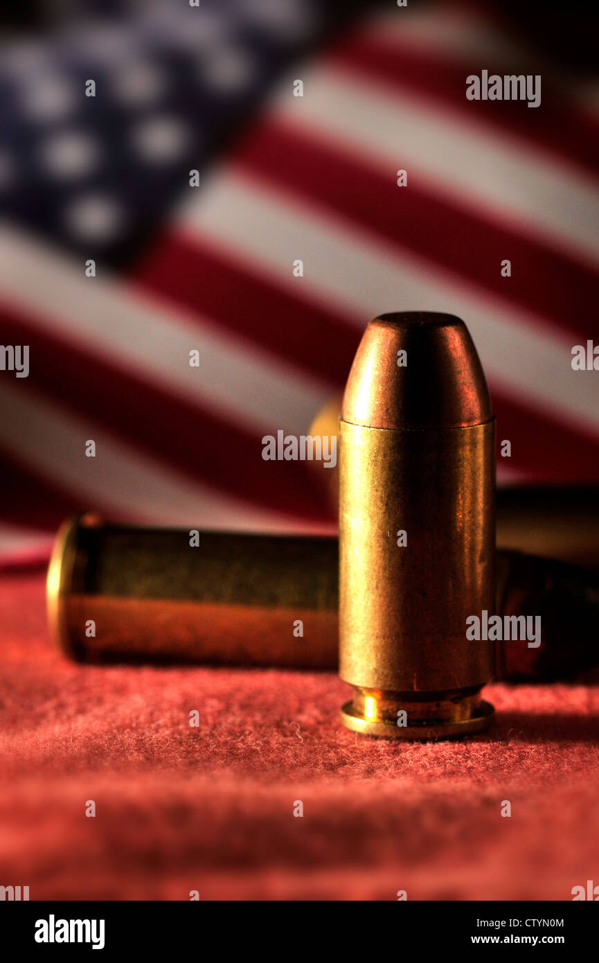 Undischarged rounds from guns with an American flag. Stock Photo