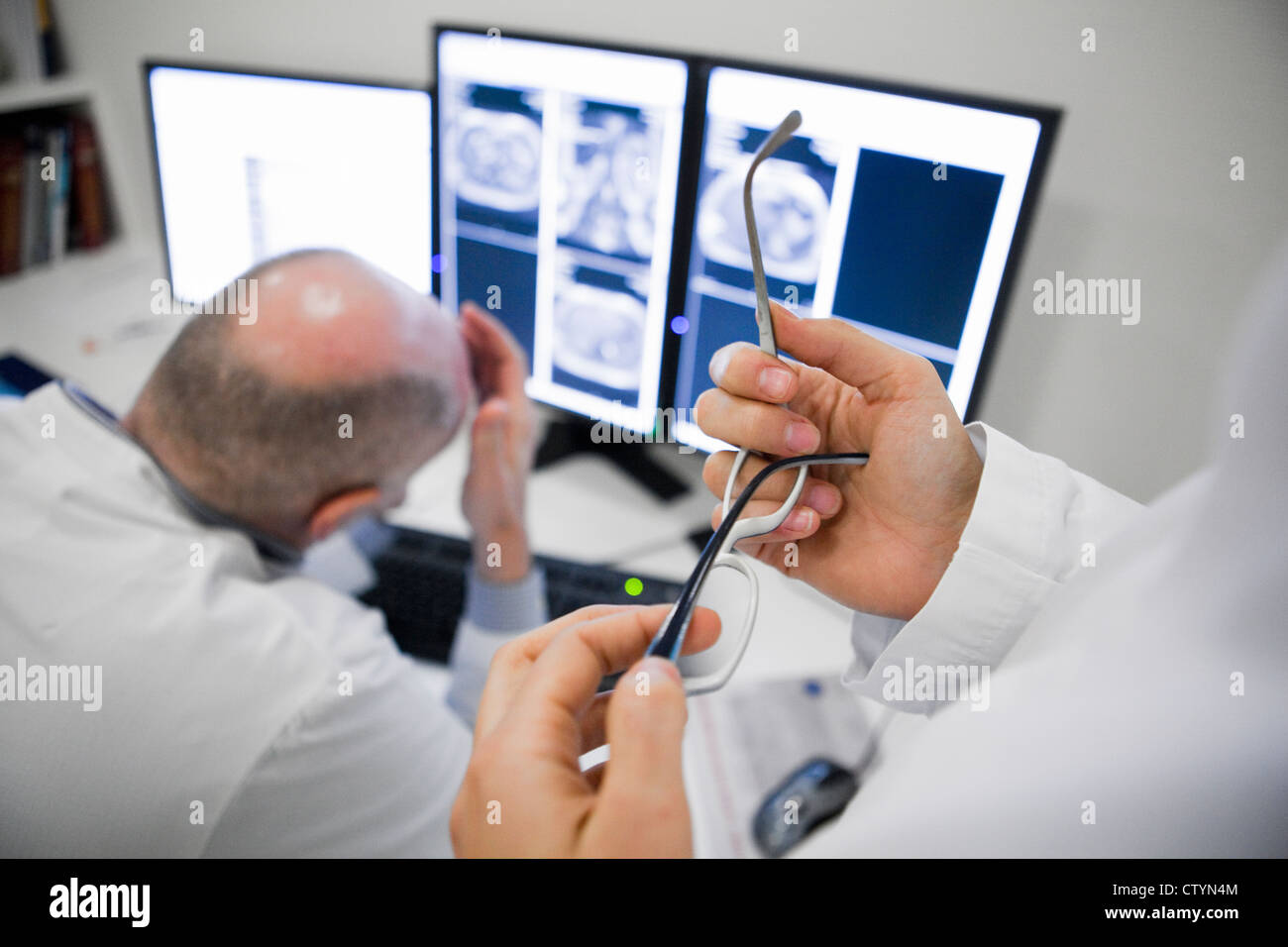 Radiologist discussing patients data Stock Photo